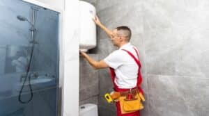 professional plumber working in a bathroom, plumbing repair service, assemble and install concept plumber tools and equipment in a bathroom